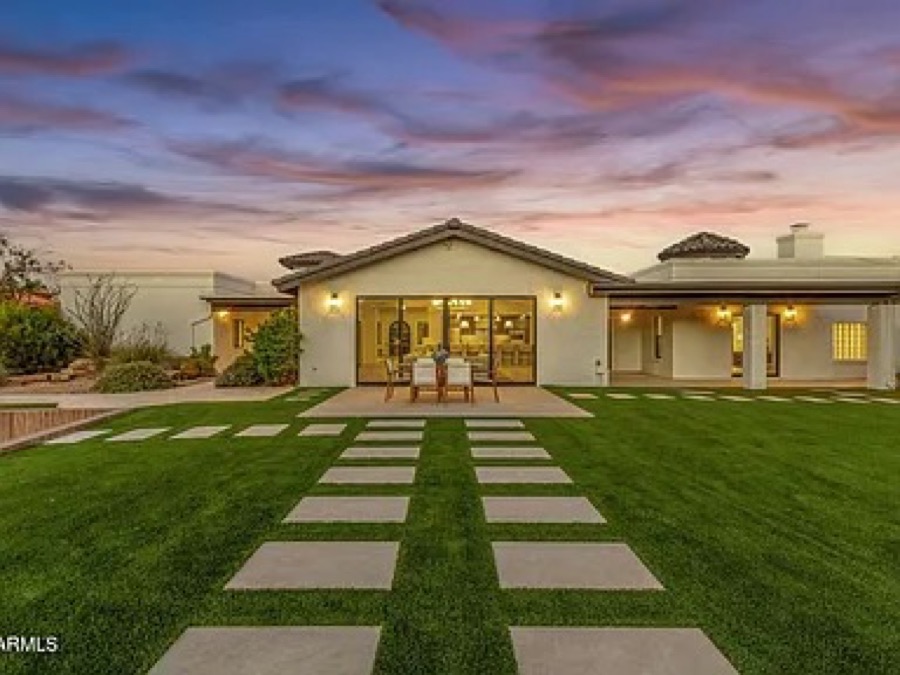 Full backyard remodel exterior at dusk by Turfli
