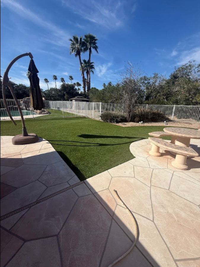 Turf and stamped concrete patio by Turfli