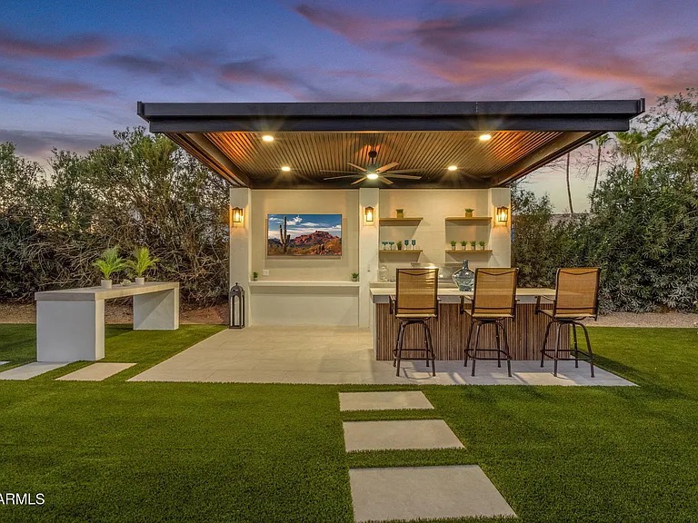 Custom outdoor kitchen cabana and bar installed by Turfli